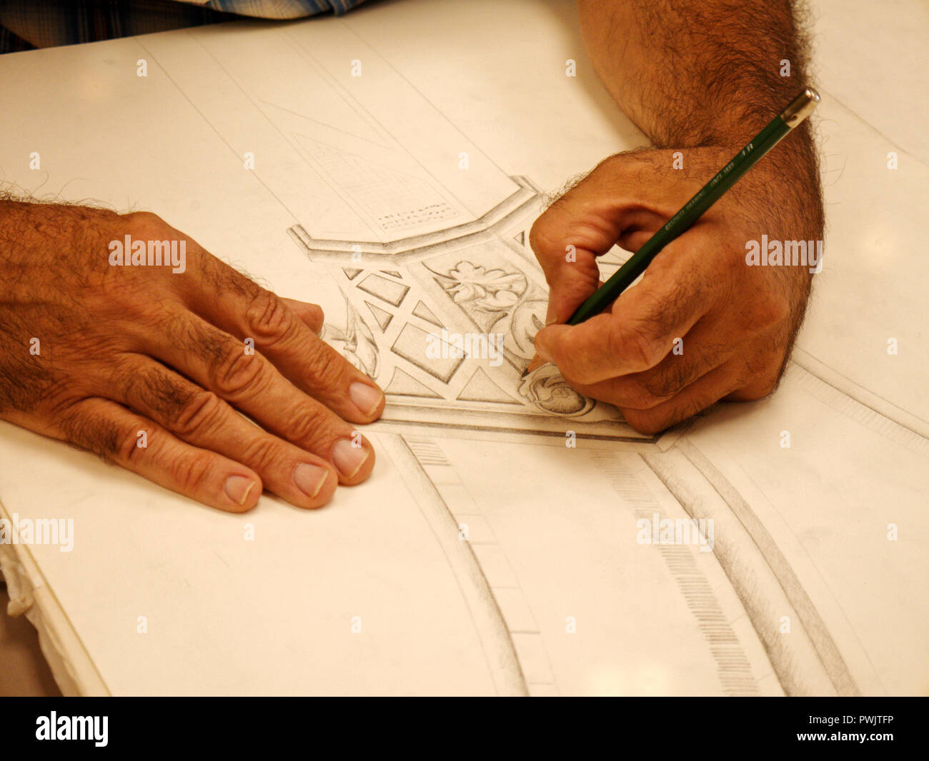 An artist  sketching out a design project.. Stock Photo