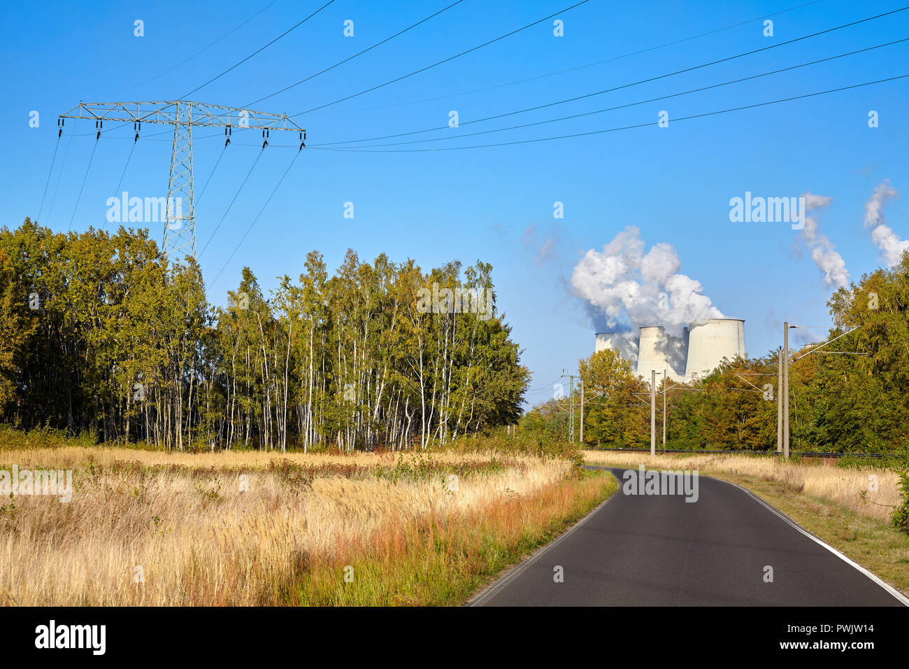 Road to a power plant, nature and industry concept. Stock Photo