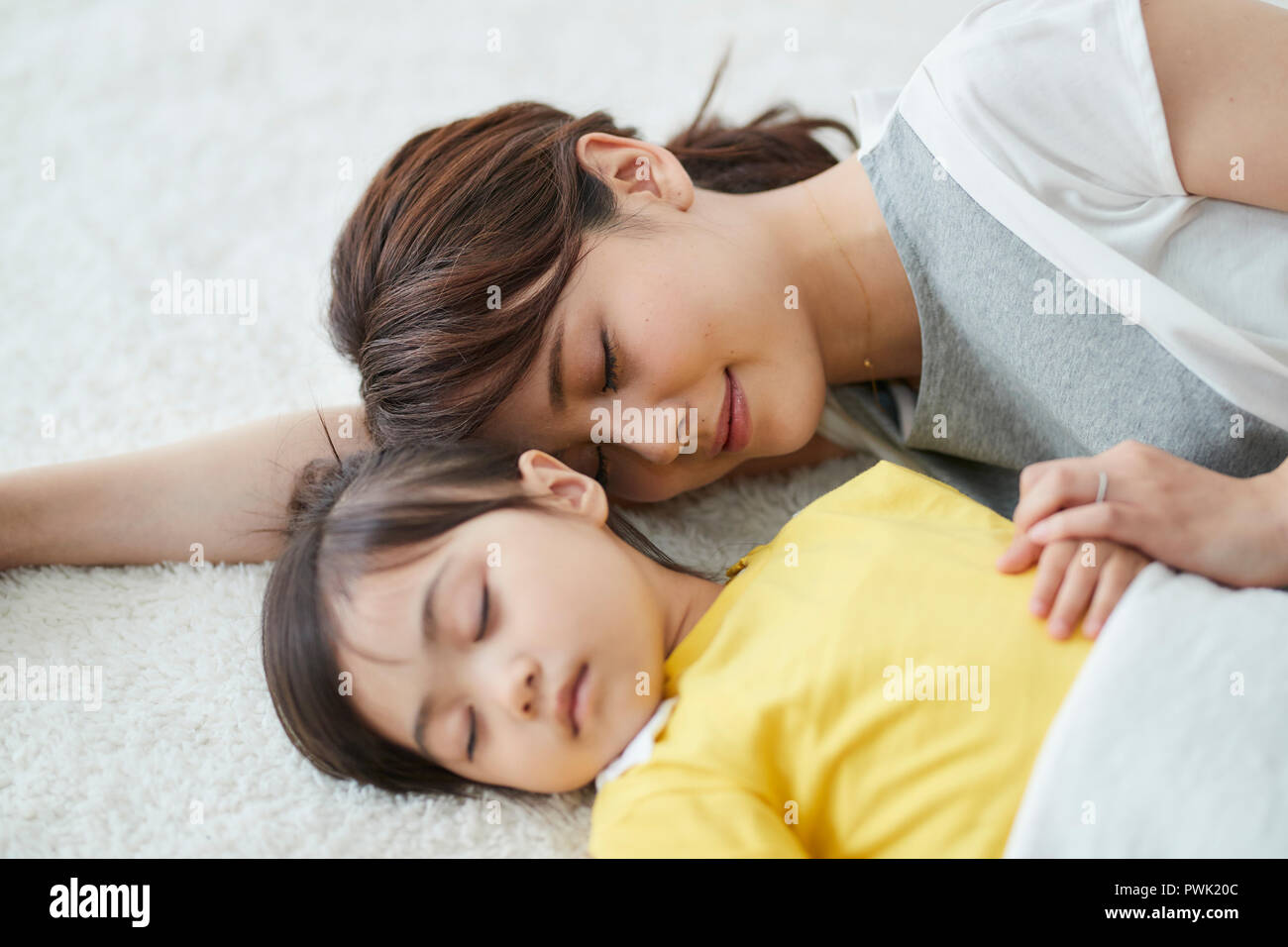 Japanese mother with sleeping kid Stock Photo Alamy