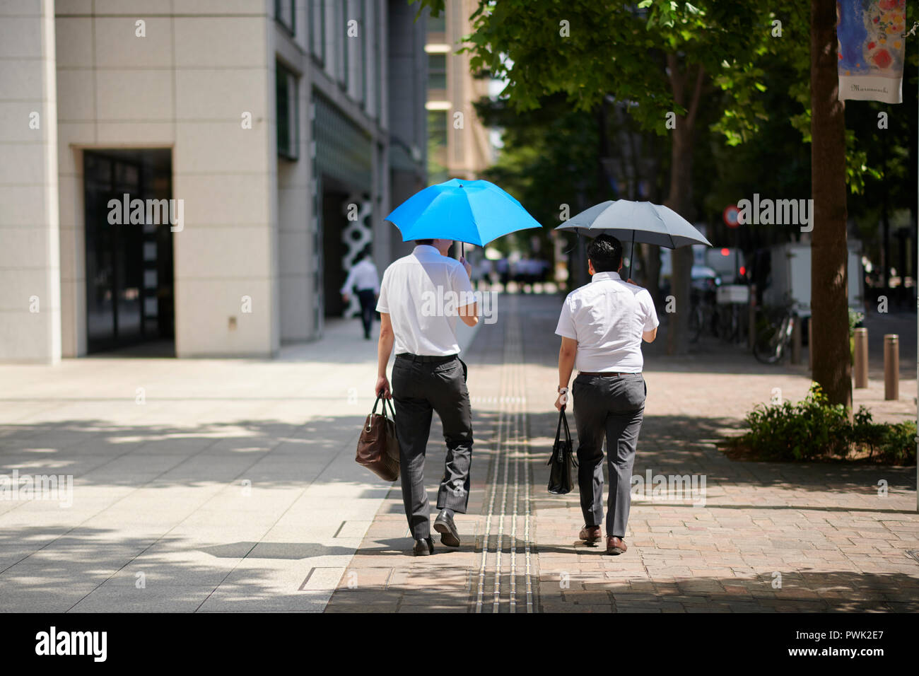 Japanese men with parasol Stock Photo - Alamy