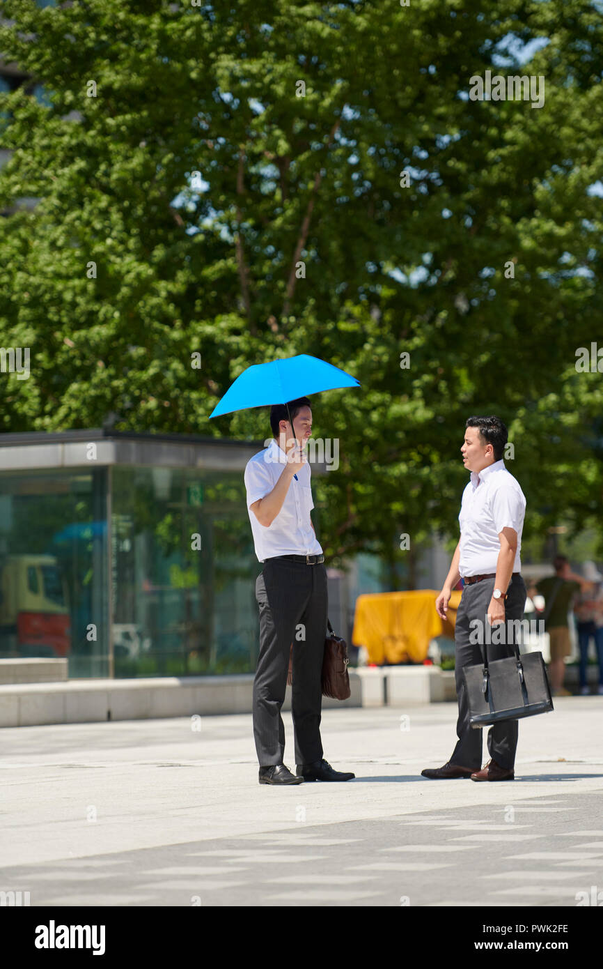 Japanese men with parasol Stock Photo - Alamy