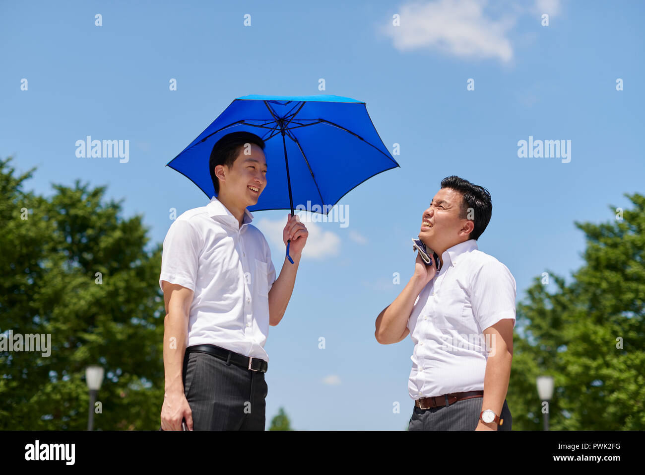 Japanese men with parasol Stock Photo - Alamy