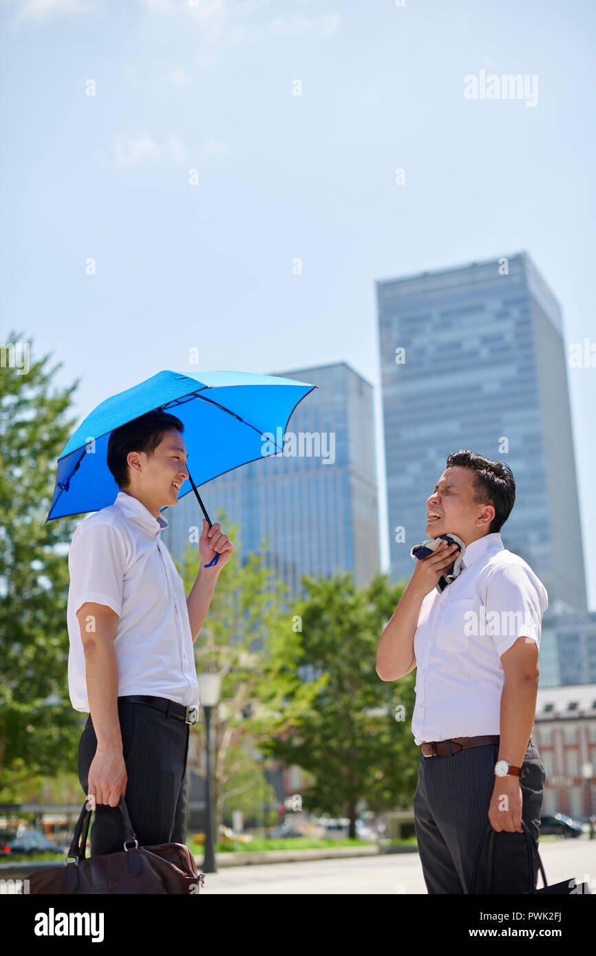 Japanese men with parasol Stock Photo - Alamy