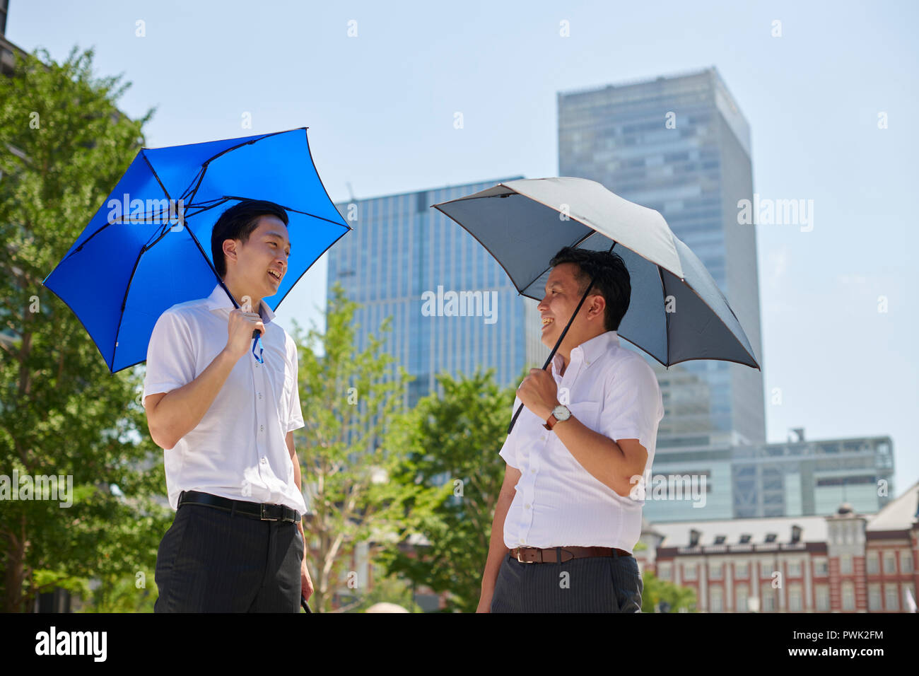 Japanese men with parasol Stock Photo - Alamy