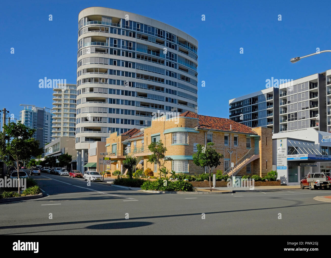 contrast between new tower block and old holiday units at tweed heads