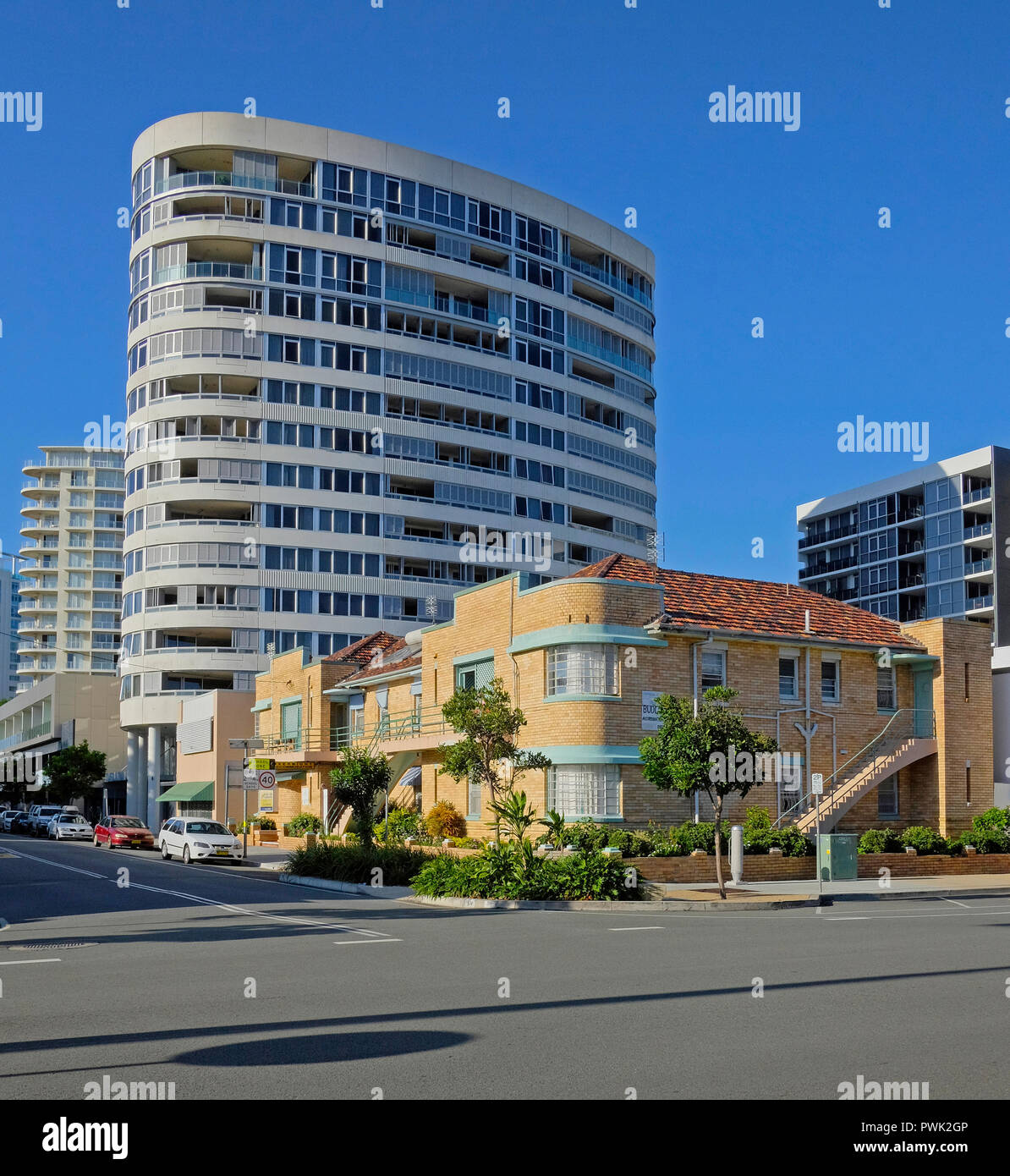 contrast between new tower block and old holiday units at tweed heads