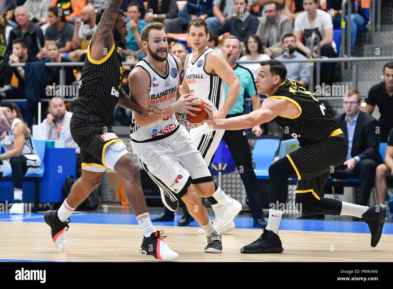 (L-R) Xavier Rathan-Mayes of AEK, Martin Kriz of Nymburk and Jonas Maciulis of AEK in action during the Men's Basketball Champions League 2nd round group C match CEZ Basketball Nymburk vs AEK Athens in Prague, Czech Republic, October 16, 2018. (CTK Photo/Michal Kamaryt) Stock Photo