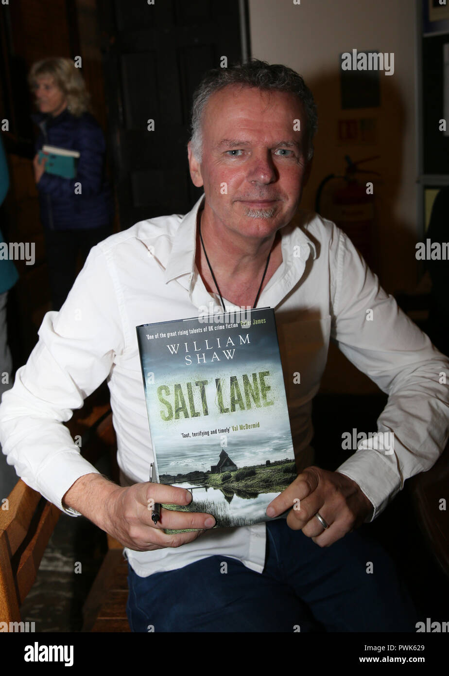 Rochdale, Lancashire, UK. 16th October, 2018. Writer William Shaw with a  copy of his novel, Salt lane at the Literature and ideas festival,  Rochdale. 16th October 2018 Credit: Barbara Cook/Alamy Live News