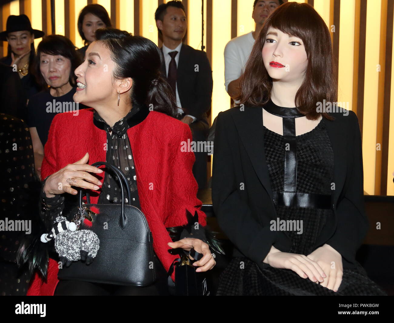 Actress Norika Fujiwara and a humanoid robot AOI ERICA are seen during 'Tae  Ashida 2019 spring and summer collection' of Amazon Fashion Week Tokyo at  the National Art Center Tokyo, Japan on