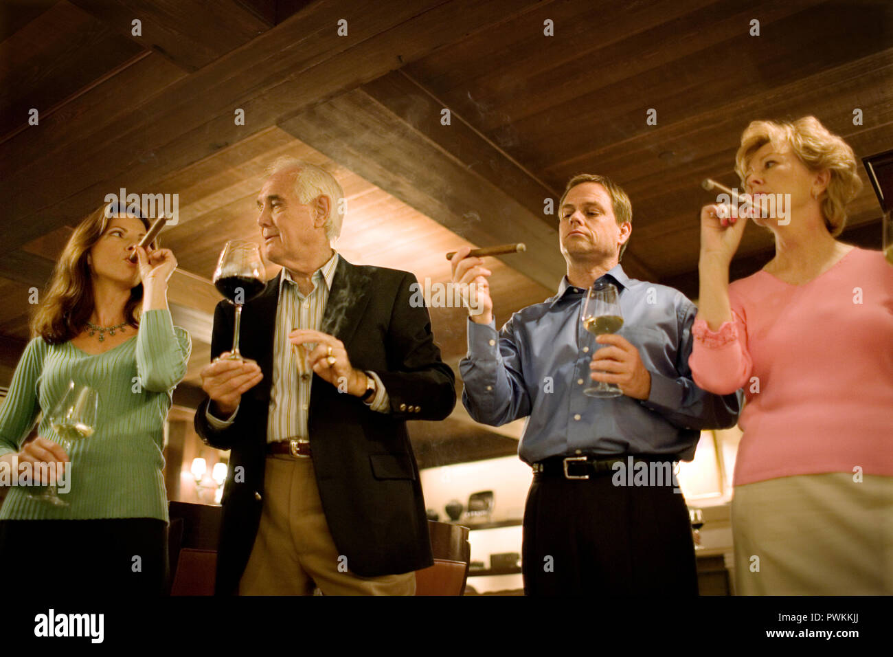 group drinking wine and smoking cigars Stock Photo Alamy