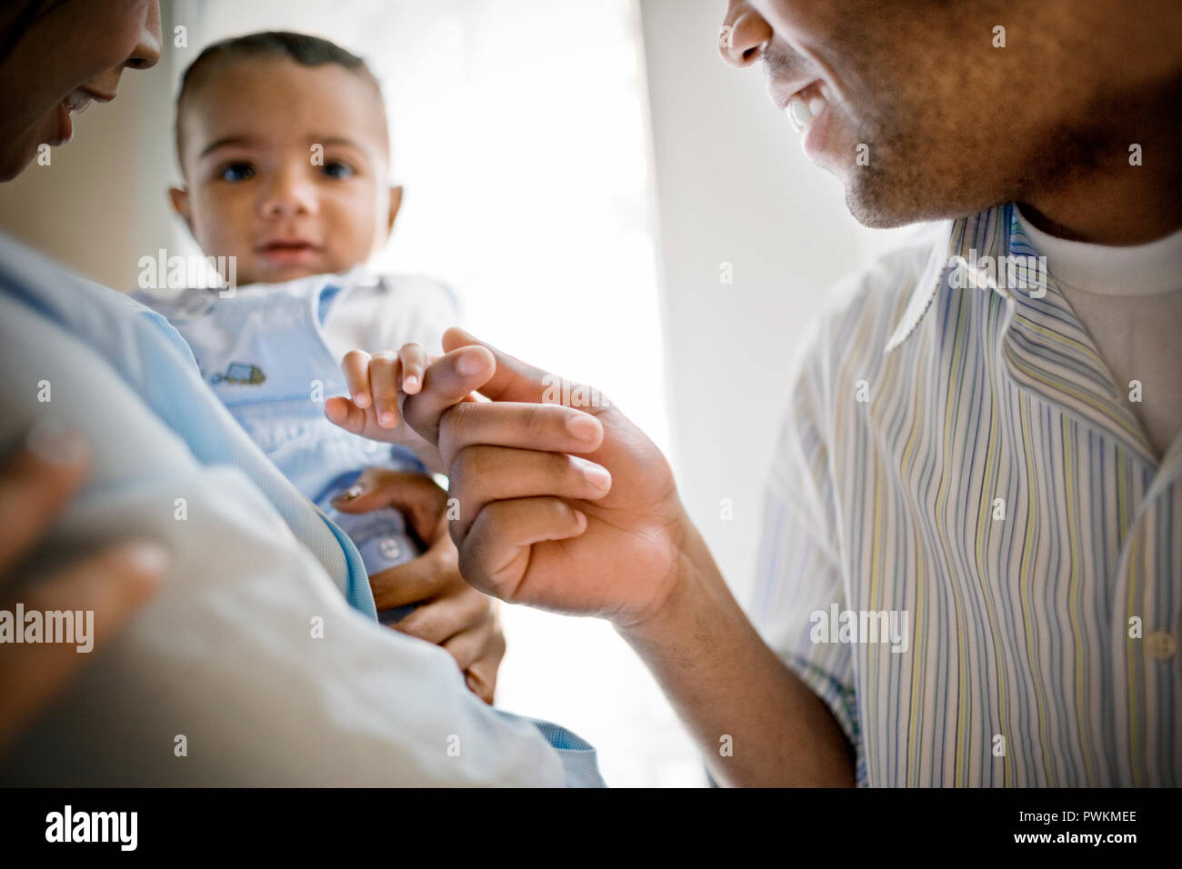 Mid-adult man the hand of his baby boy. Stock Photo