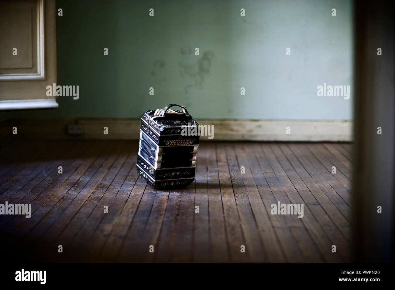 View of a case placed on a hardwood flooring. Stock Photo