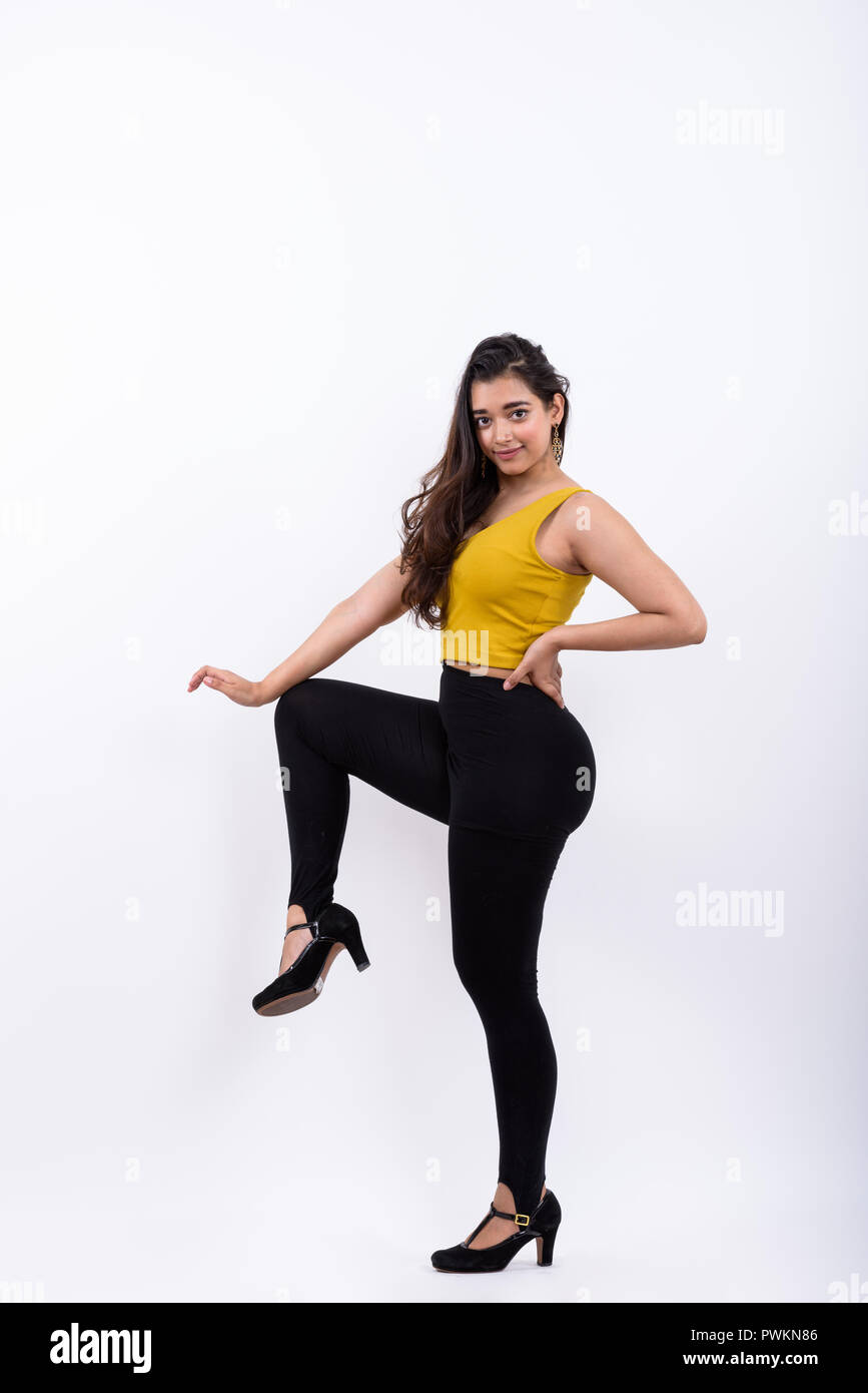 Full body shot of young beautiful Indian woman posing Stock Photo