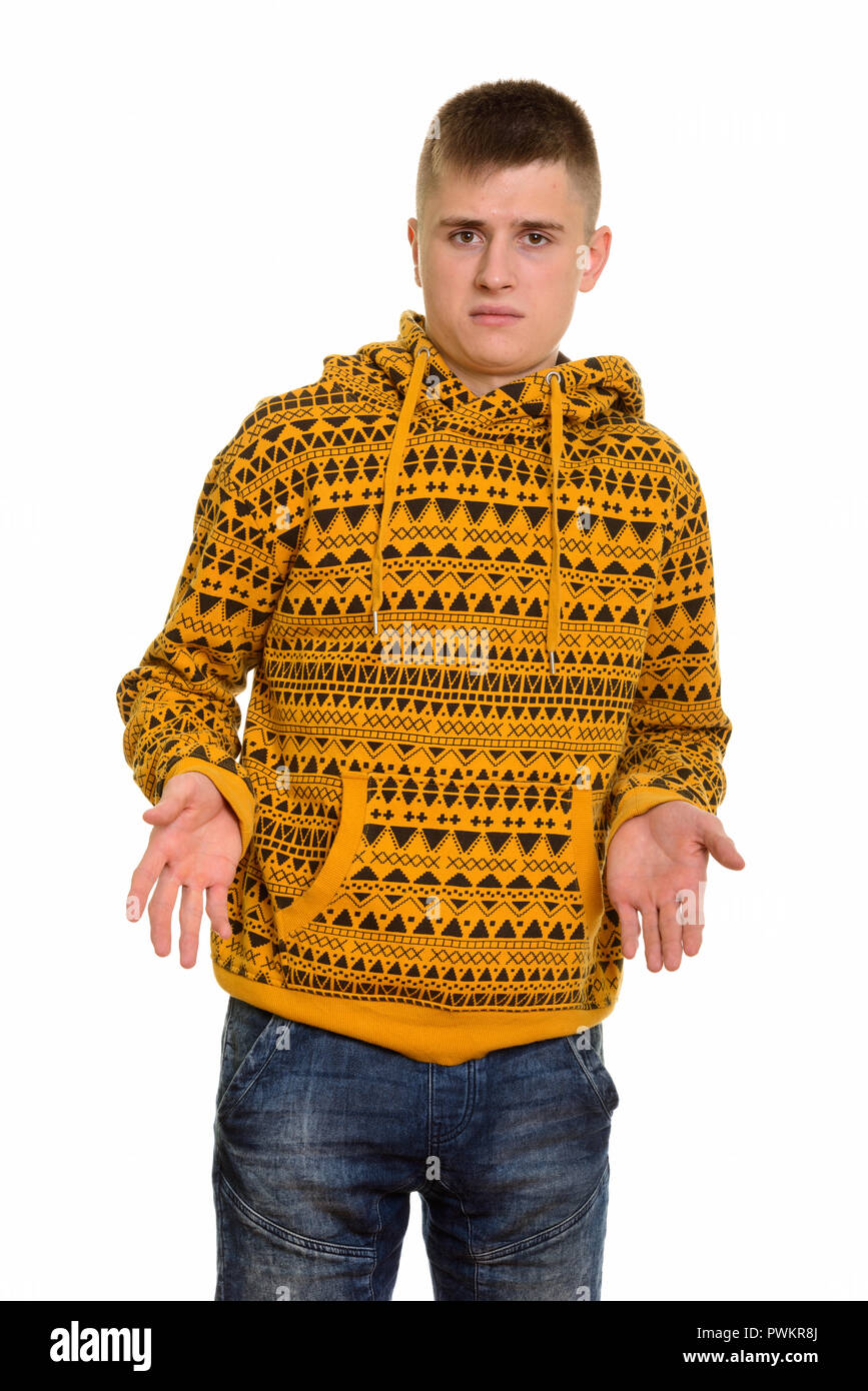 Young Caucasian man shrugging shoulders looking confused Stock Photo