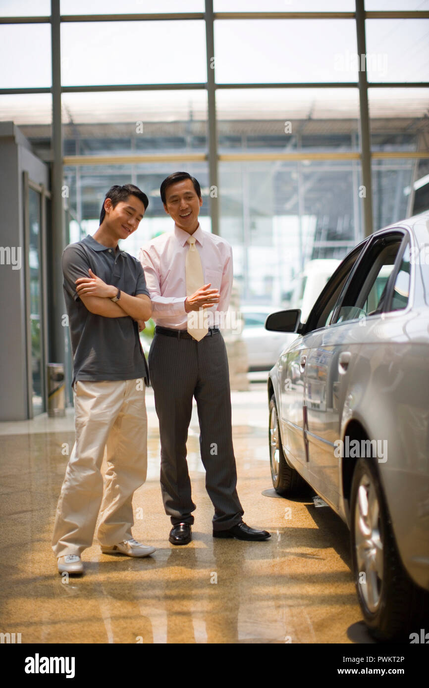 A car salesman talks to hires stock photography and images Alamy
