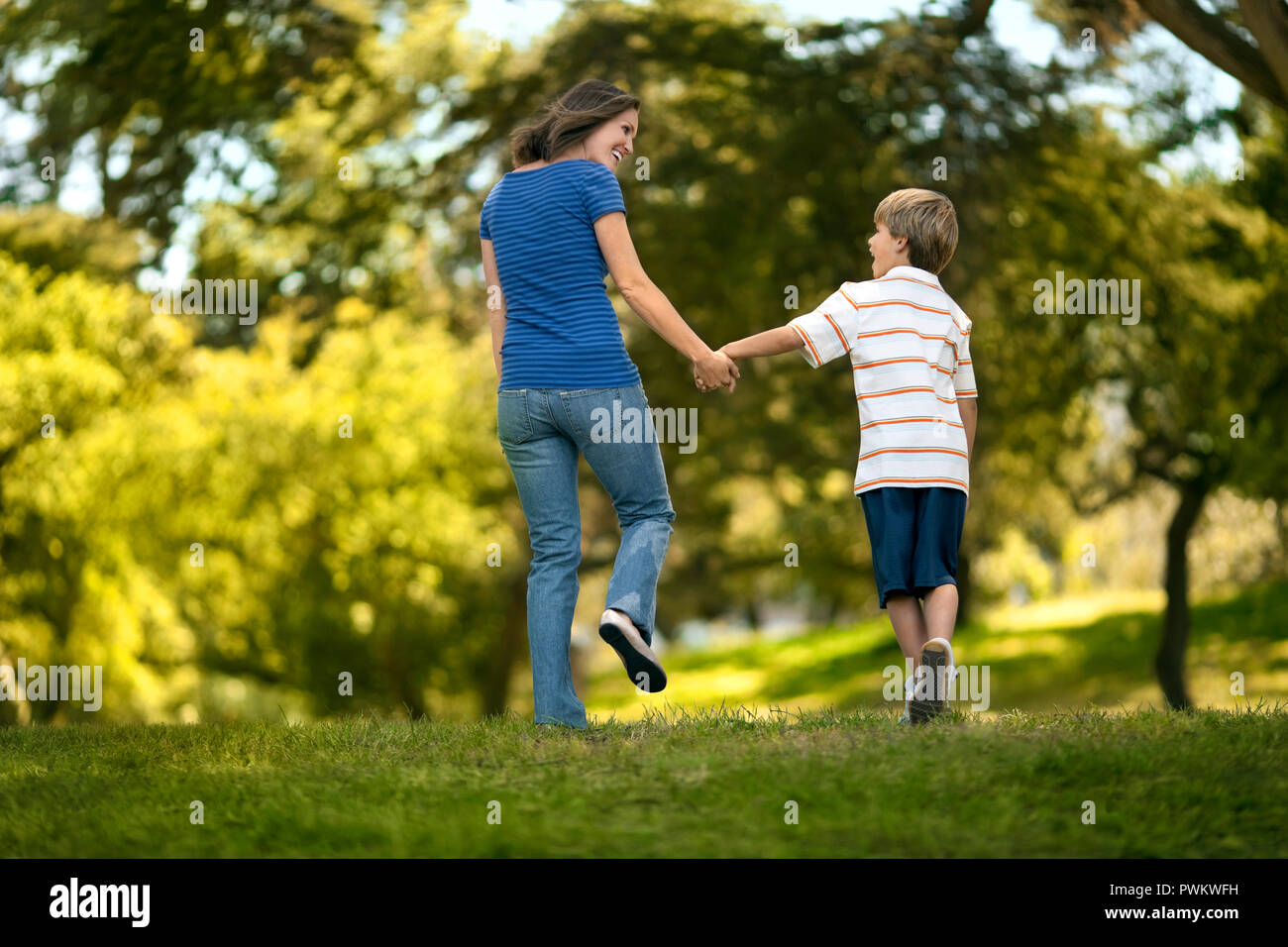 Mother and son playing in the park. Stock Photo