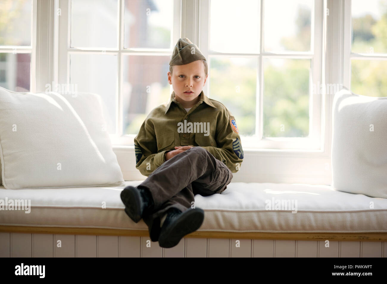 Portrait of a young boy dressed in a military costume. Stock Photo