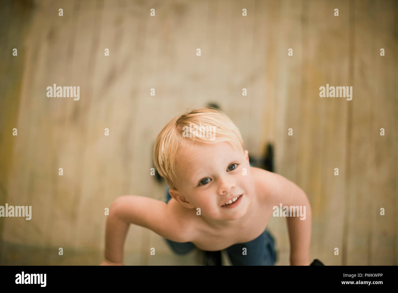 Little boy looking up at camera Stock Photo Alamy