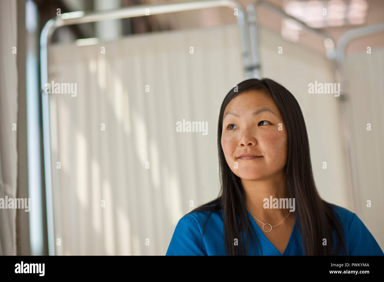 Woman nurse wearing scrubs hi-res stock photography and images - Alamy