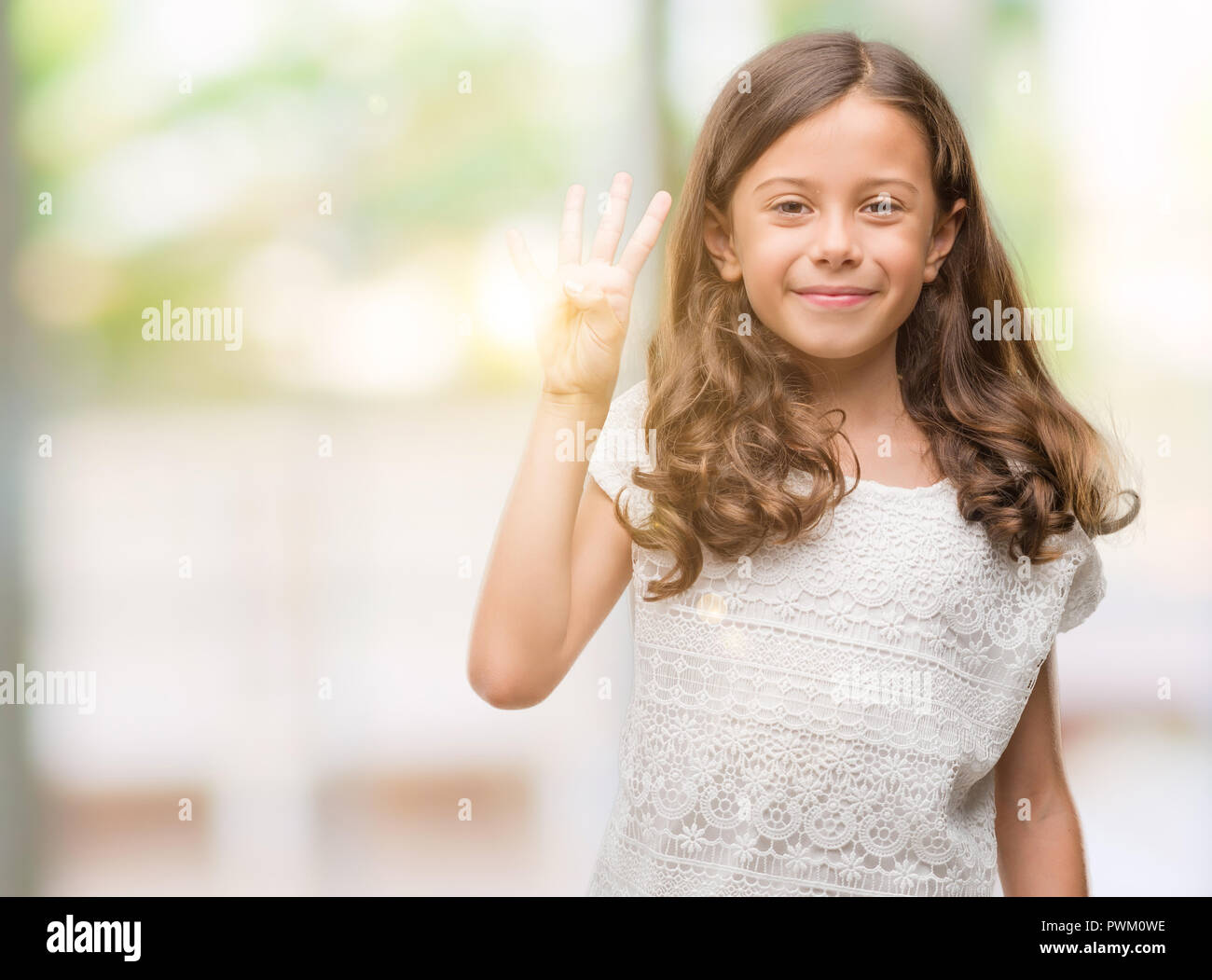 Girl showing four fingers hand hi-res stock photography and images - Alamy