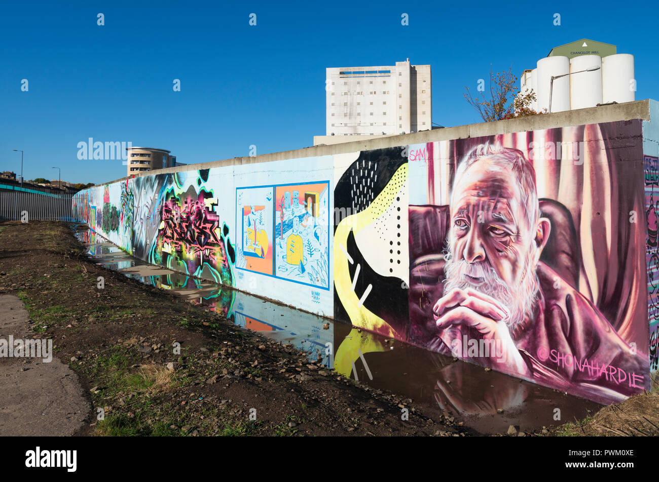 View of murals painted on wall at Marine Parade Graffiti Wall in Leith , Scotland, Stock Photo