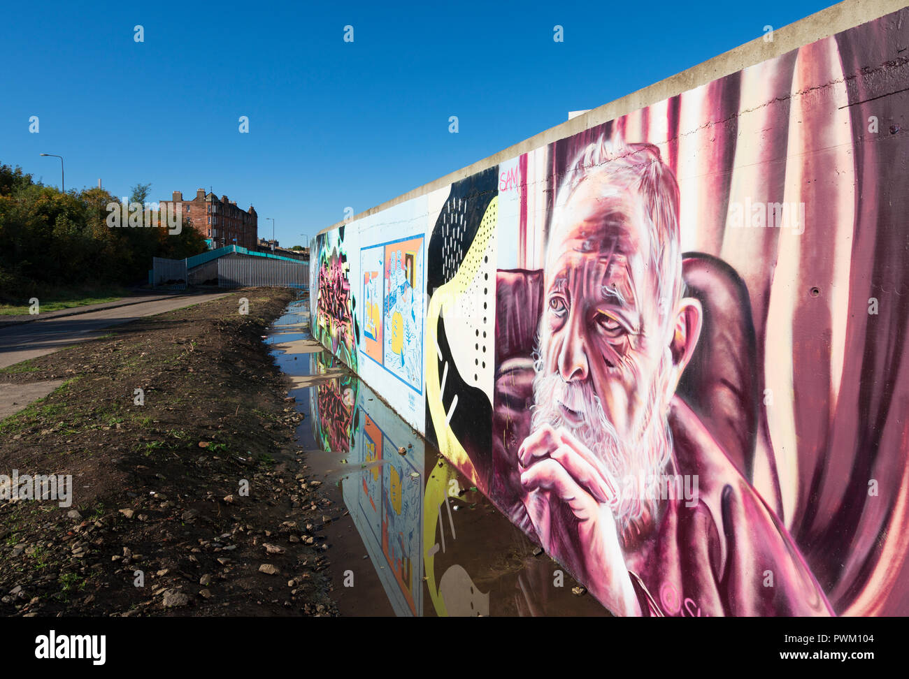 View of murals painted on wall at Marine Parade Graffiti Wall in Leith , Scotland, Stock Photo