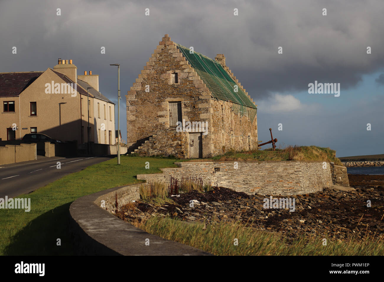 The old storehouse in St. Mary's, Orkney, Uk, was built in 1649 for the village. It has crow-stepped gables, also called corbie step in Scotland. Stock Photo