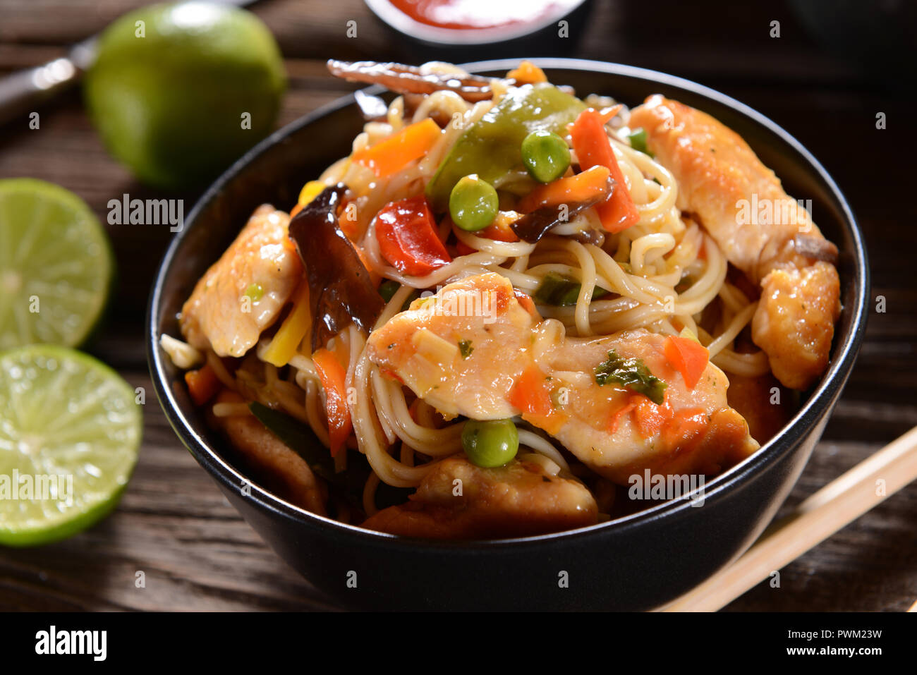 Chicken with Rice Noodles and Vegetables Stock Photo - Alamy