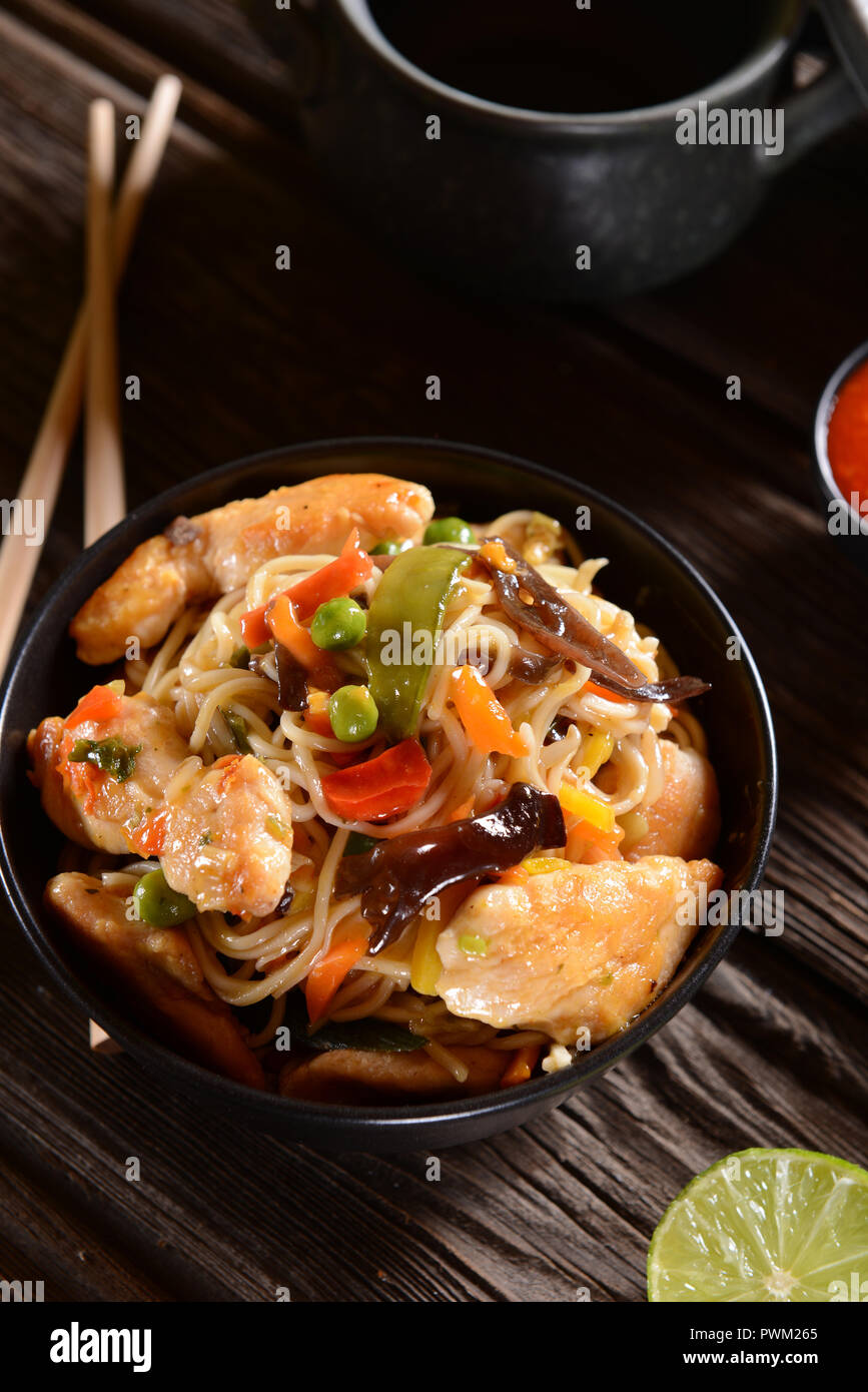 Chicken with Rice Noodles and Vegetables Stock Photo - Alamy