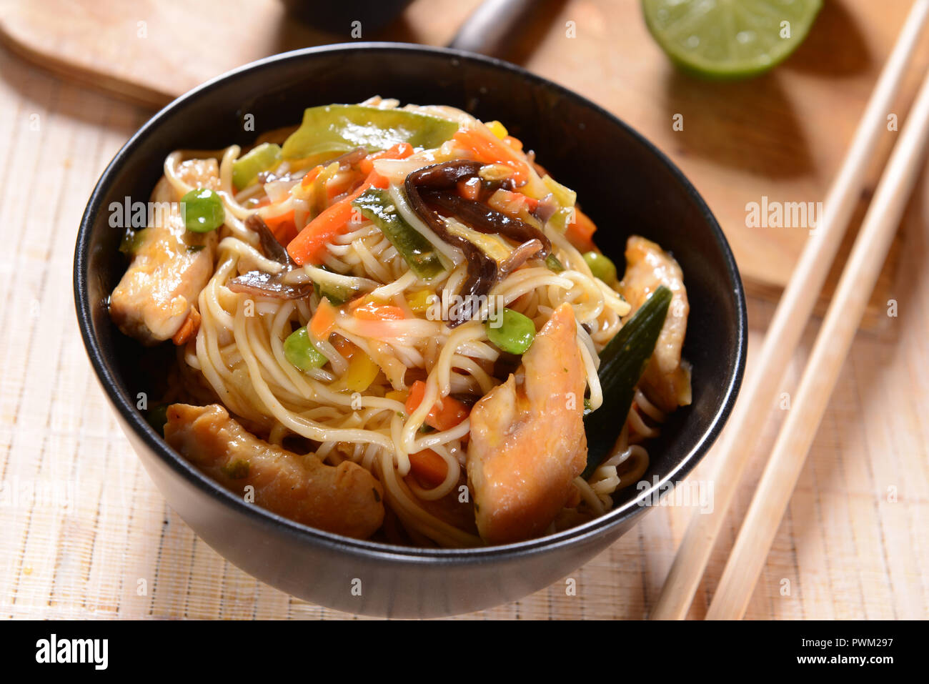 Chicken with Rice Noodles and Vegetables Stock Photo - Alamy