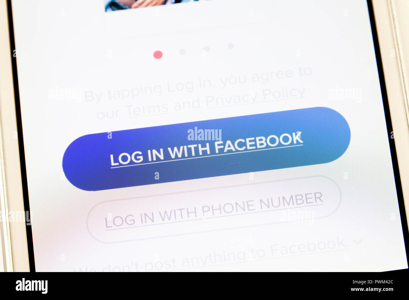 'Log In With Facebook' message on mobile app - USA Stock Photo