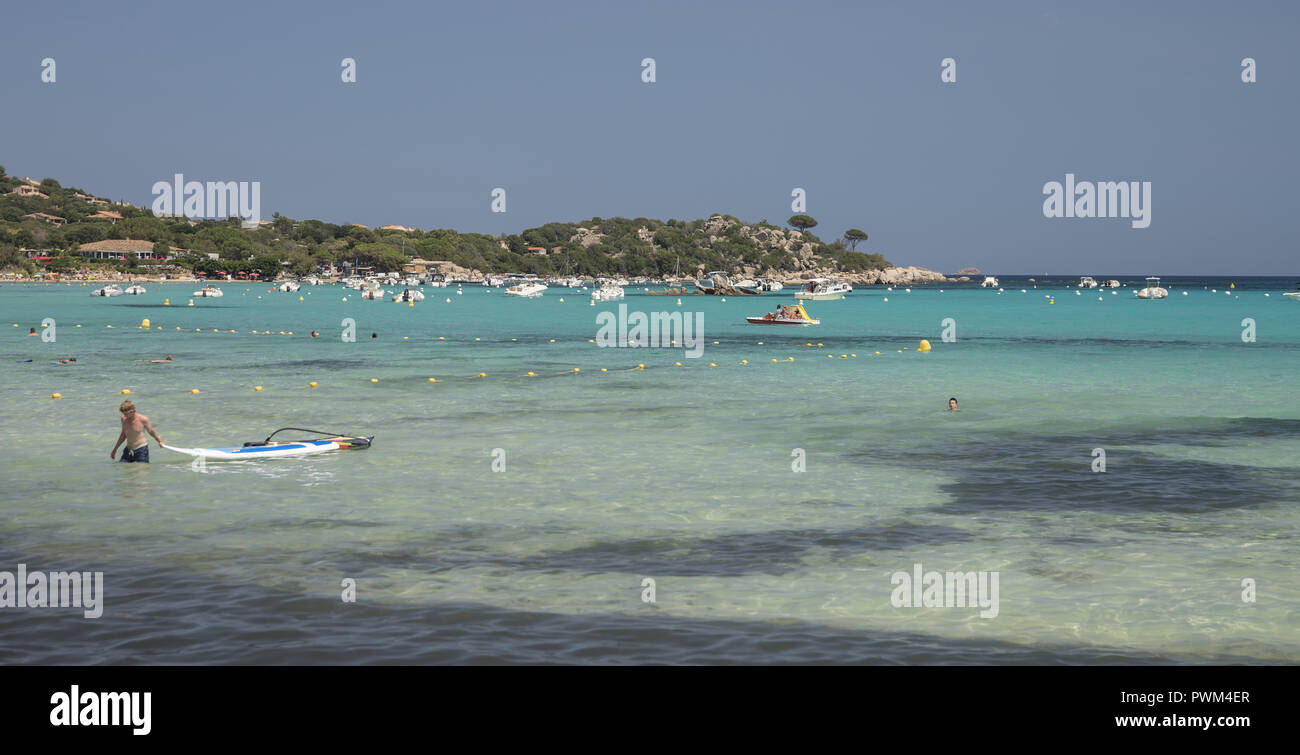 Tourist recreational water vehicles in the bay of Santa Giulia. Beach of Santa Giulia in Corsica. Plaża Santa Giulia na Korsyce. Stock Photo