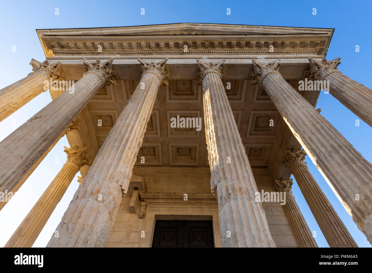 Inspired by the temples of Apollo and Mars in Rome the Maison Carrée is the only preserved Roman temple left from the ancient world.  The Maison Carre Stock Photo