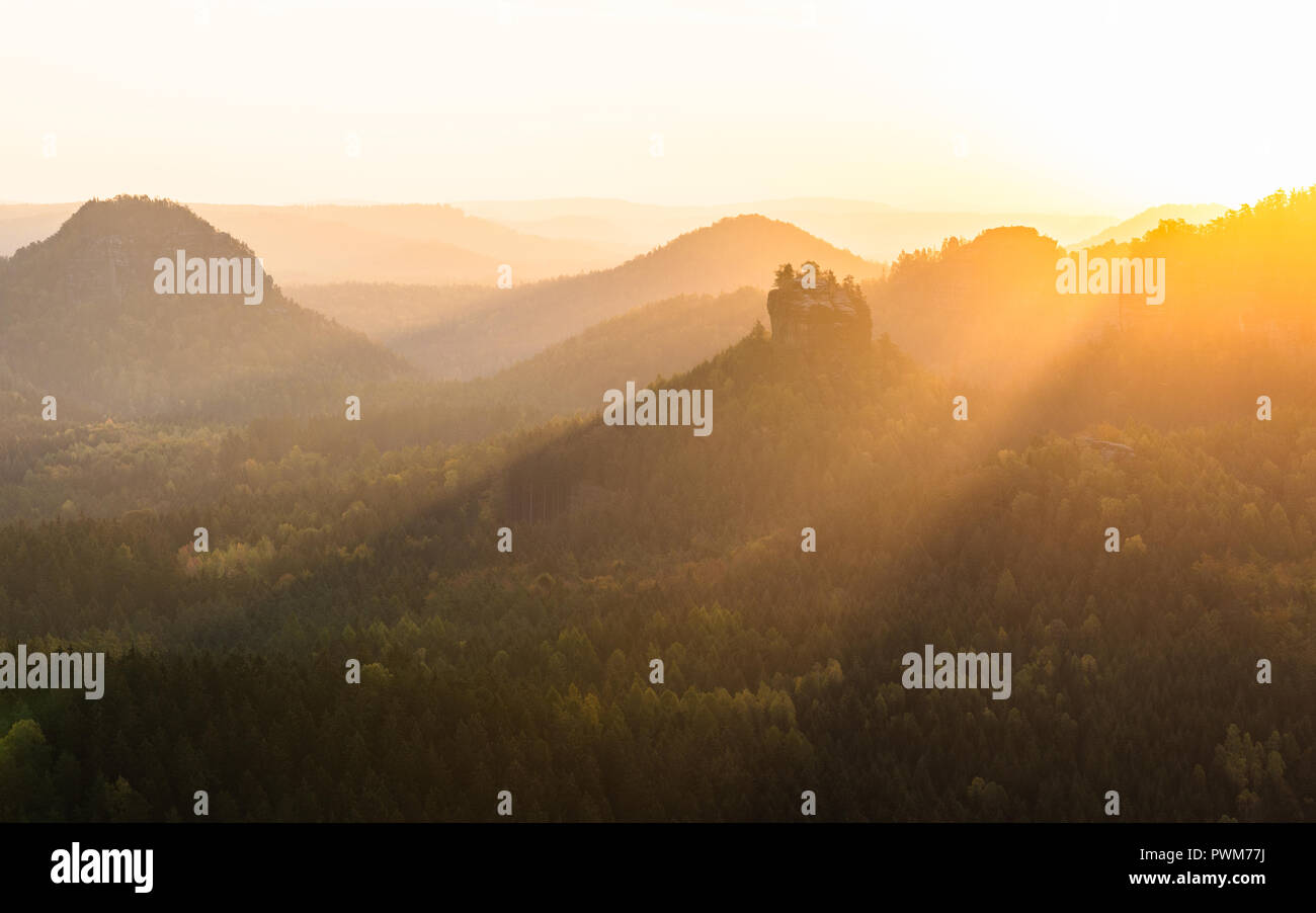 view over rock formation Winterstein at sunrise, located in the Elbe Sandstone National park – the Saxon Switzerland in Eastern Germany Stock Photo