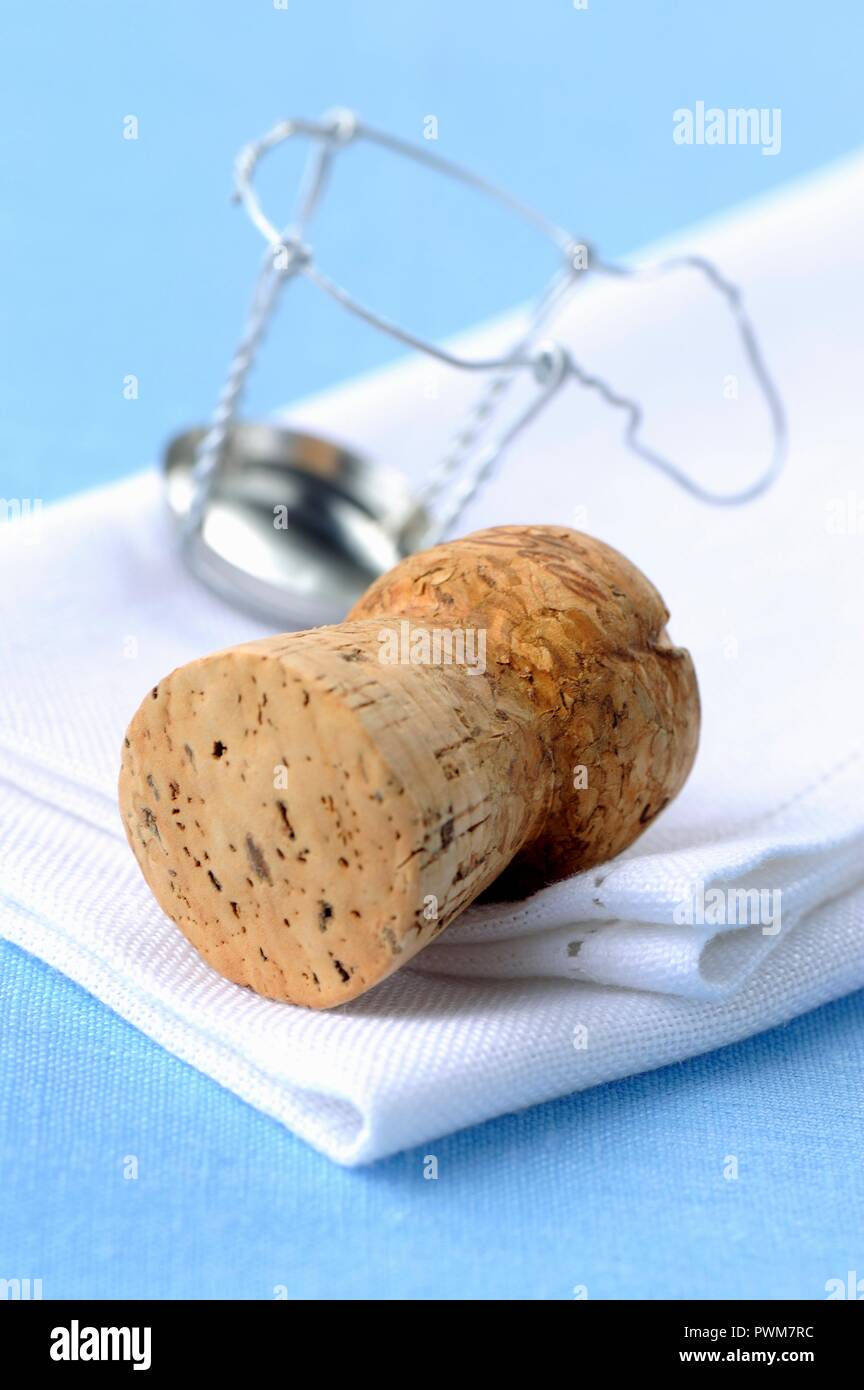 Champagne cork and a wire cork holder Stock Photo