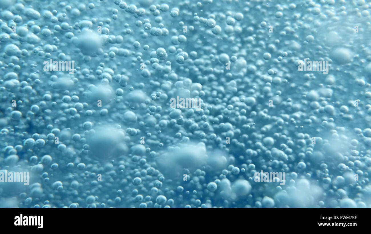Close up shot of air bubbles taken underwater symbolising the essence of life and the universe. A great background to use for science and technology t Stock Photo