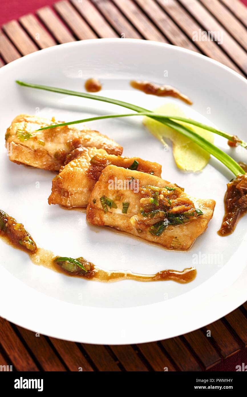 Hake fillet with soy sauce and honey Stock Photo Alamy