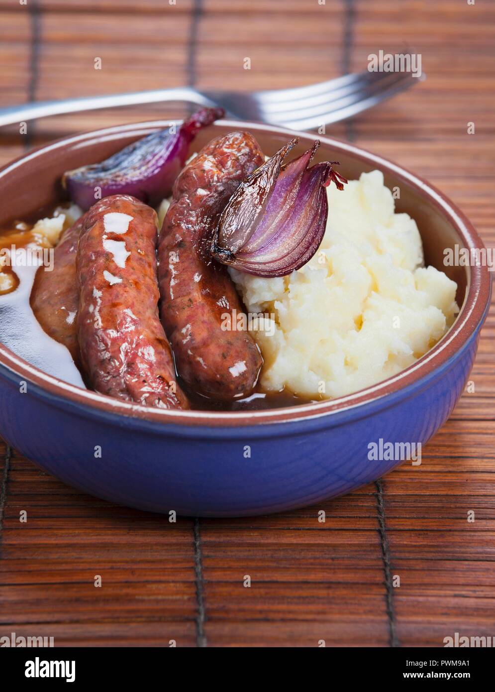 Fried sausages with mashed potatoes and gravy Stock Photo Alamy