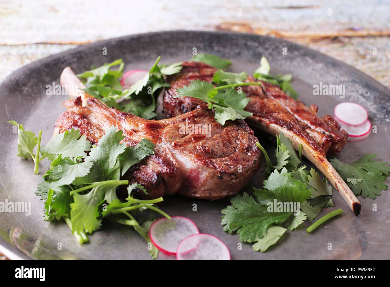 Grilled lamb chops with radishes and coriander Stock Photo Alamy