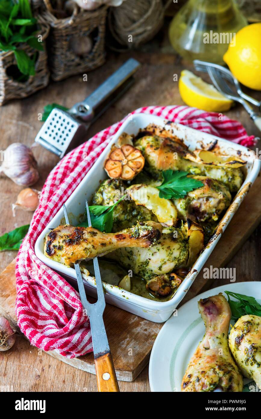 Chicken legs roasted in parsley, lemon and garilc Stock Photo
