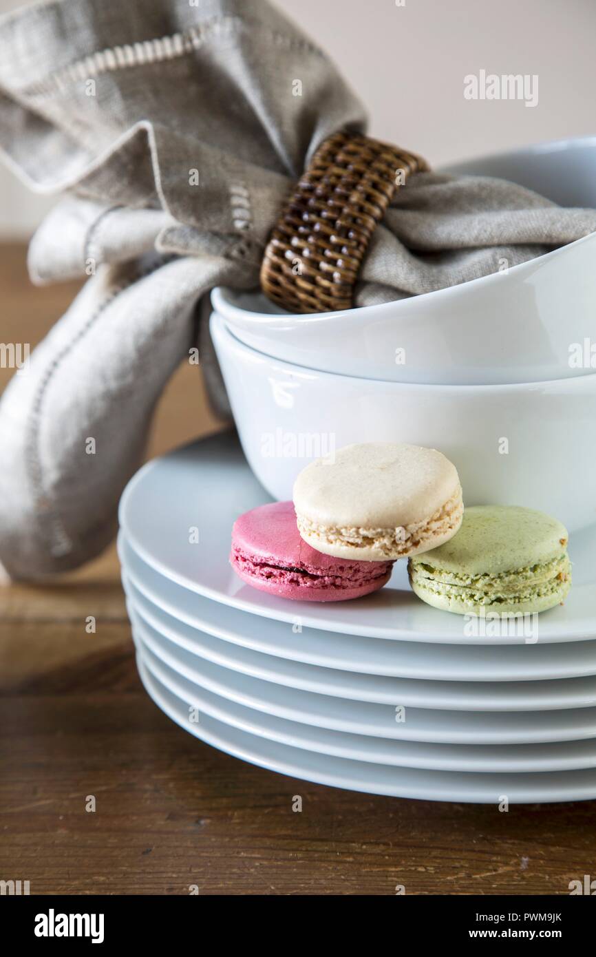 Macarons on a stack of plates Stock Photo