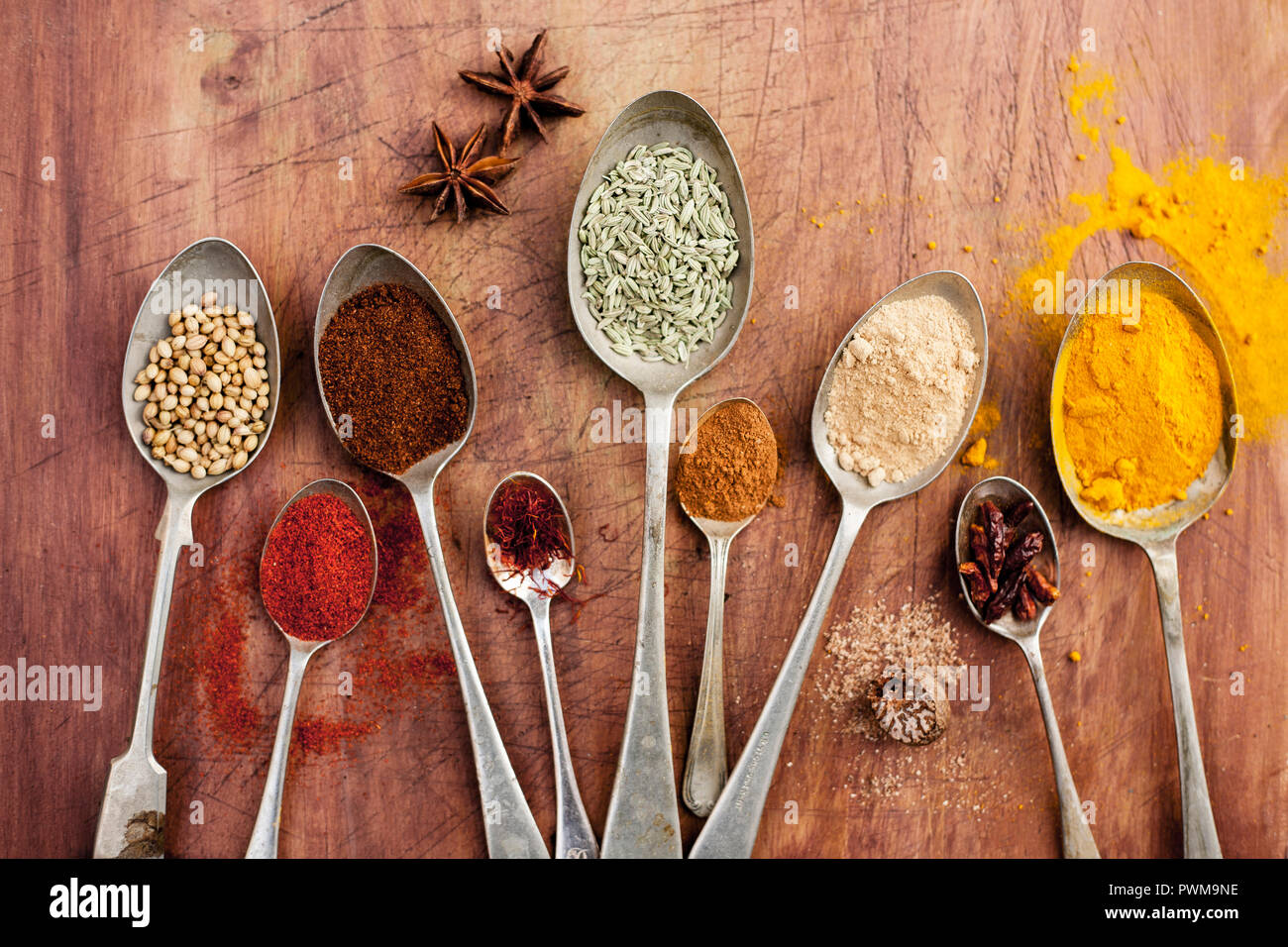 Assorted spices on vintage spoons Stock Photo