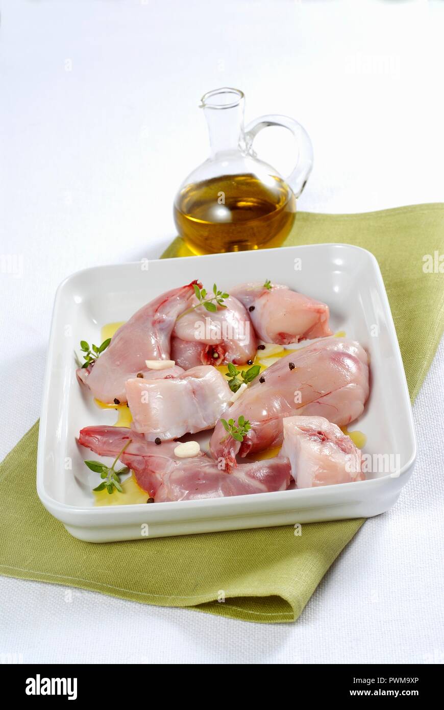 Raw rabbit meat in a marinade Stock Photo