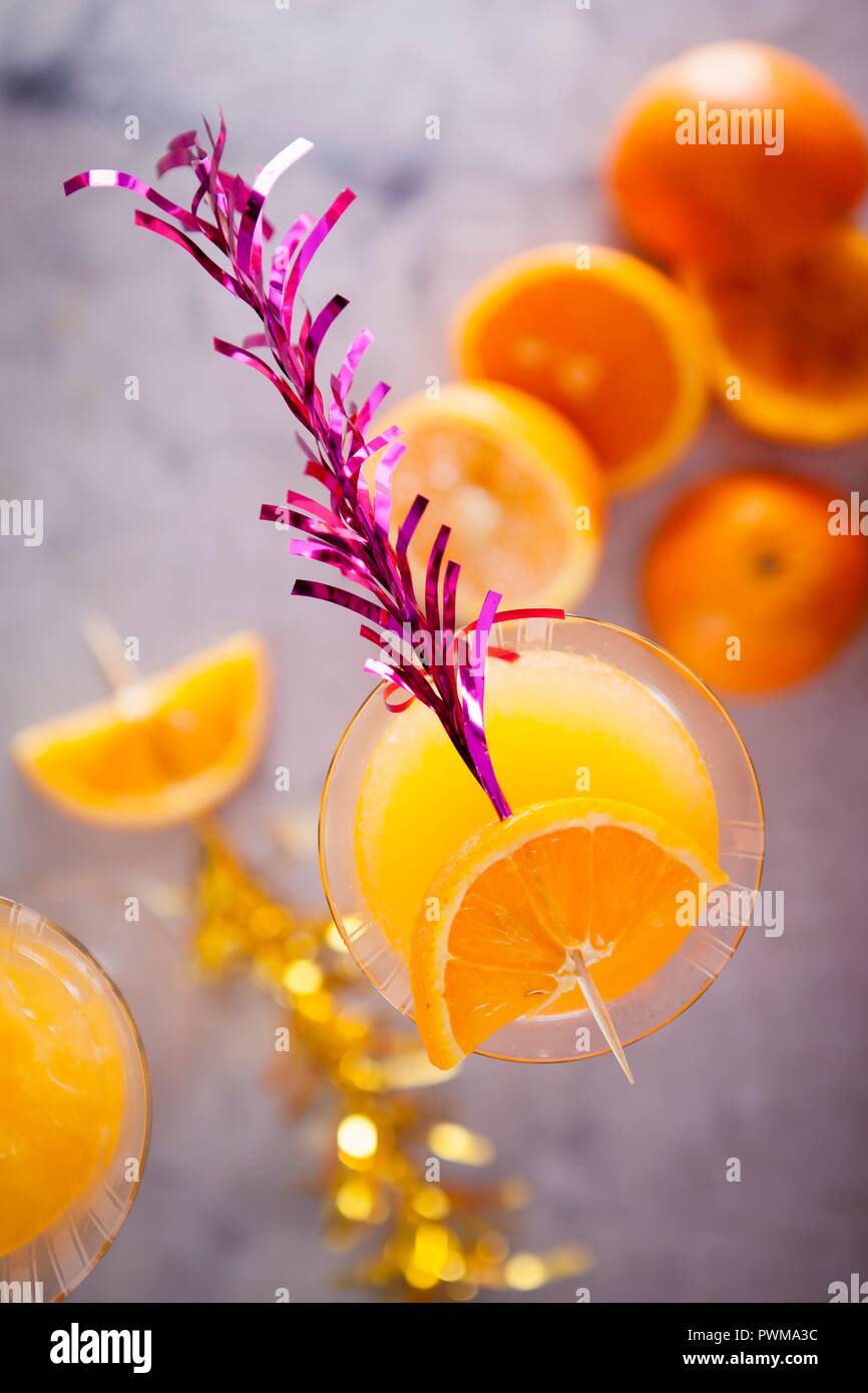 Apricot sour cocktails with orange juice Stock Photo Alamy