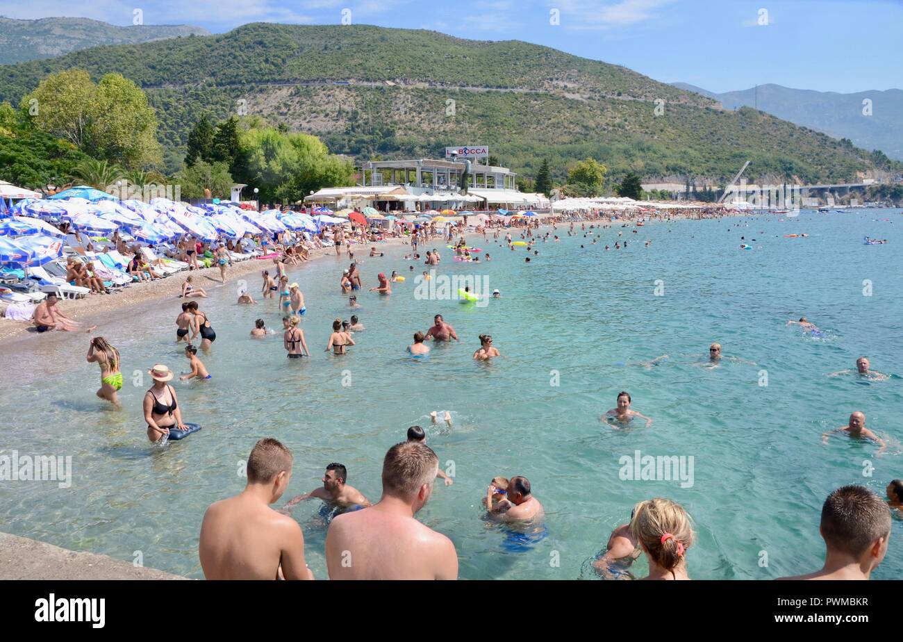 tourists enjoying the sun swimming and relaxing budva montenegro Stock Photo