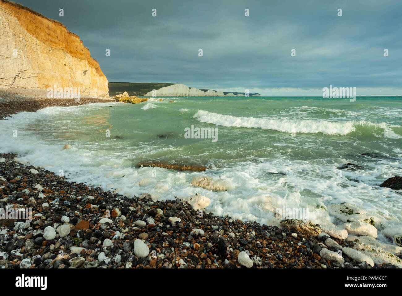 Autumn afternoon on the East Sussex coast, England. Seven Sisters cliffs loom in the distance. Stock Photo