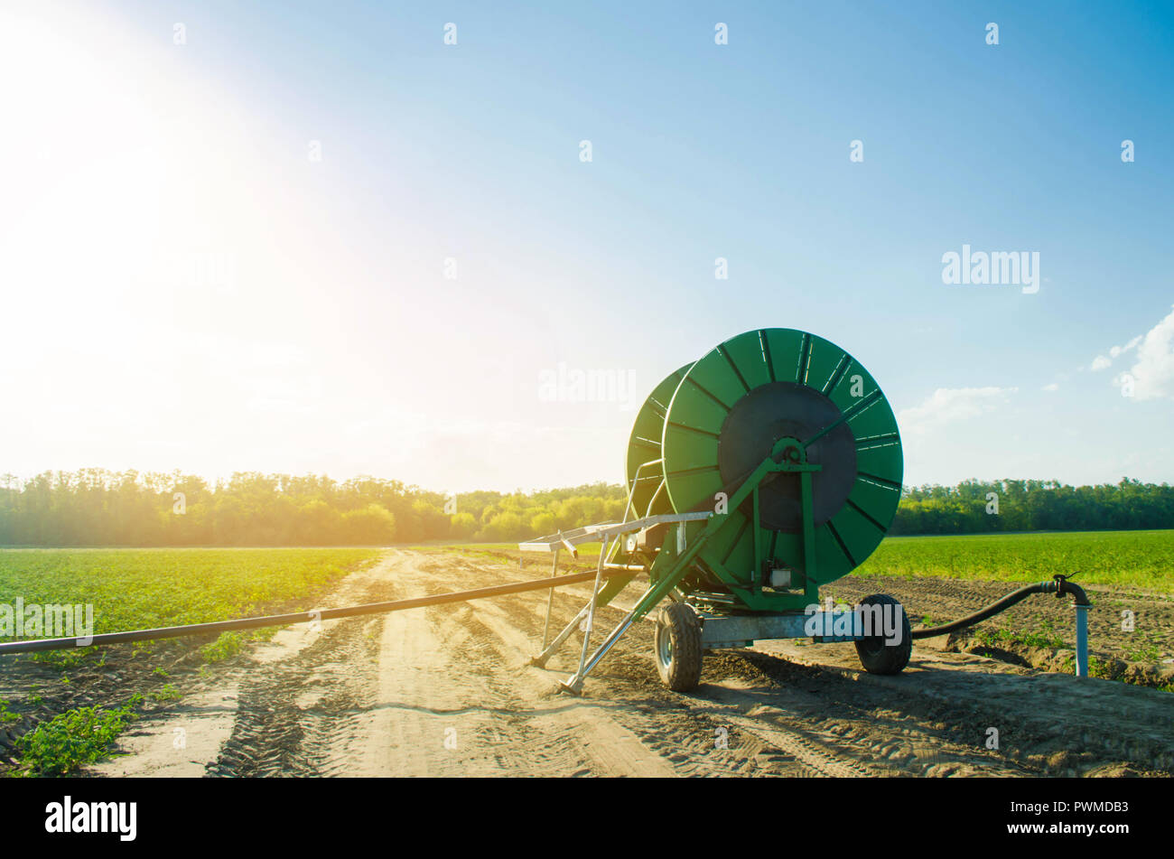 Irrigation system for watering of agricultural crops with a big hose