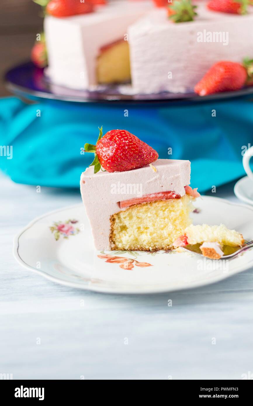 Strawberry yoghurt cake, pieces removed Stock Photo Alamy