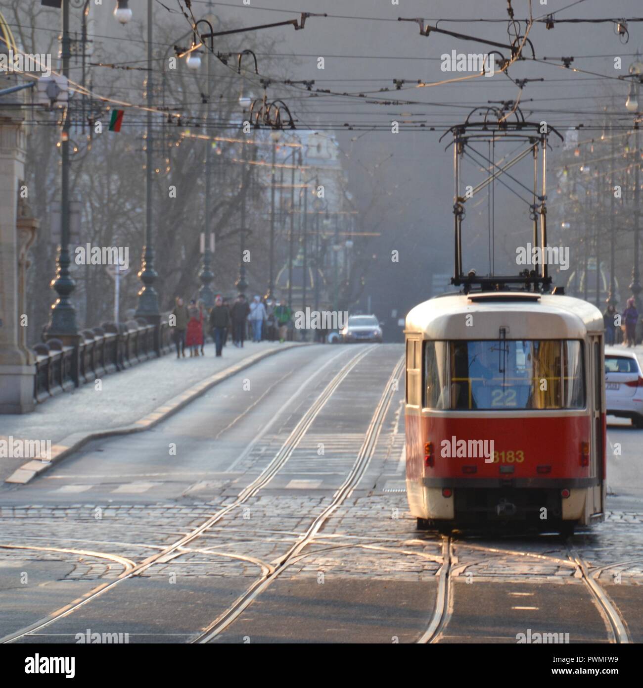 Tram car crossing bridge on sunny cold winter day in Prague Czech Republic Stock Photo