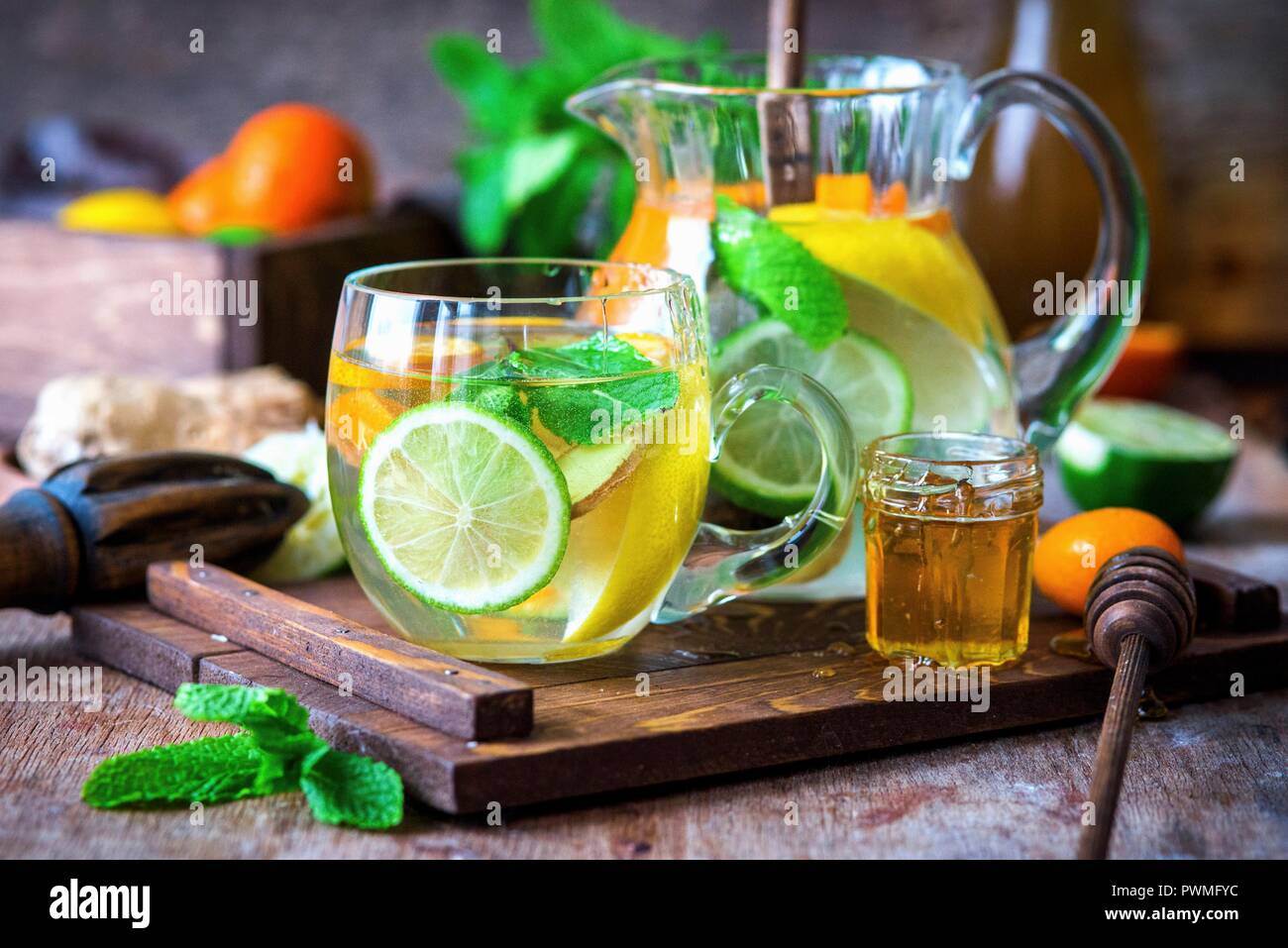 Citrus water with mint, ginger and honey Stock Photo Alamy